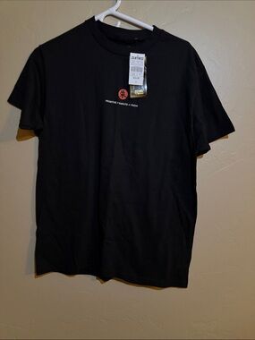 Primitive Black Short Sleeve Tee with Red Chest Logo